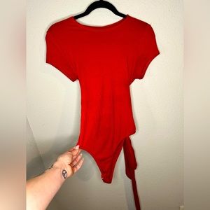 Mocking Jay - burnt orange bodysuit - size M